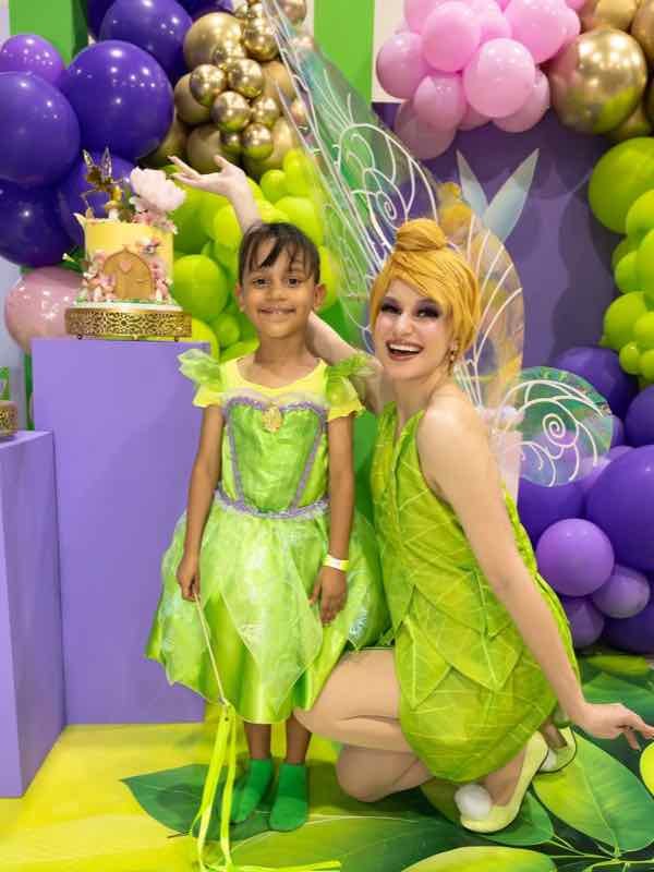 Tinker Bell character with a child at a fairy party